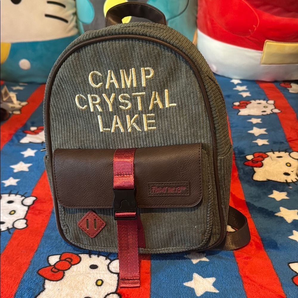 Corduroy/faux leather Camp Crystal Lake backpack with metal buckled front pocket